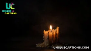 A single candle flame glowing in soft darkness