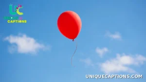 Single bright balloon floating against a clear blue sky