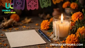 Blank note card beside a lit candle and marigold flowers on an ofrenda