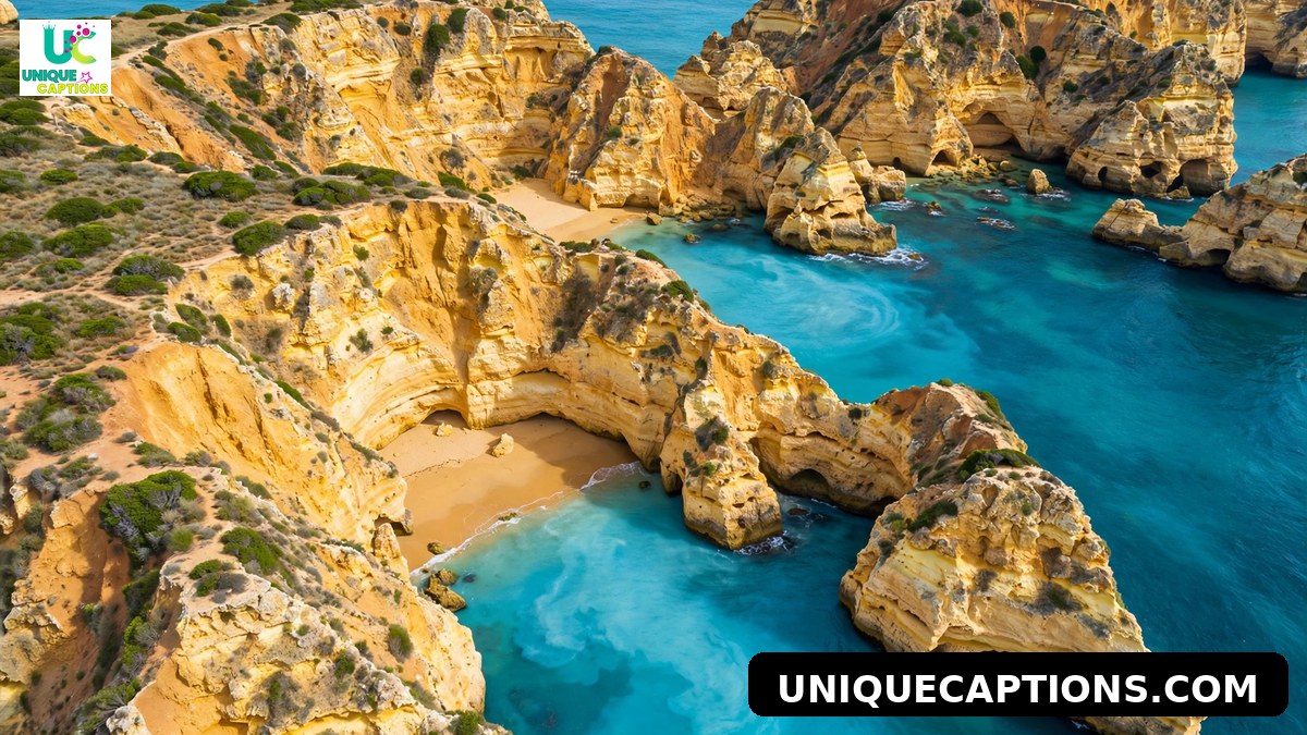 Dramatic golden sea cliffs and turquoise water at an Algarve cove beach