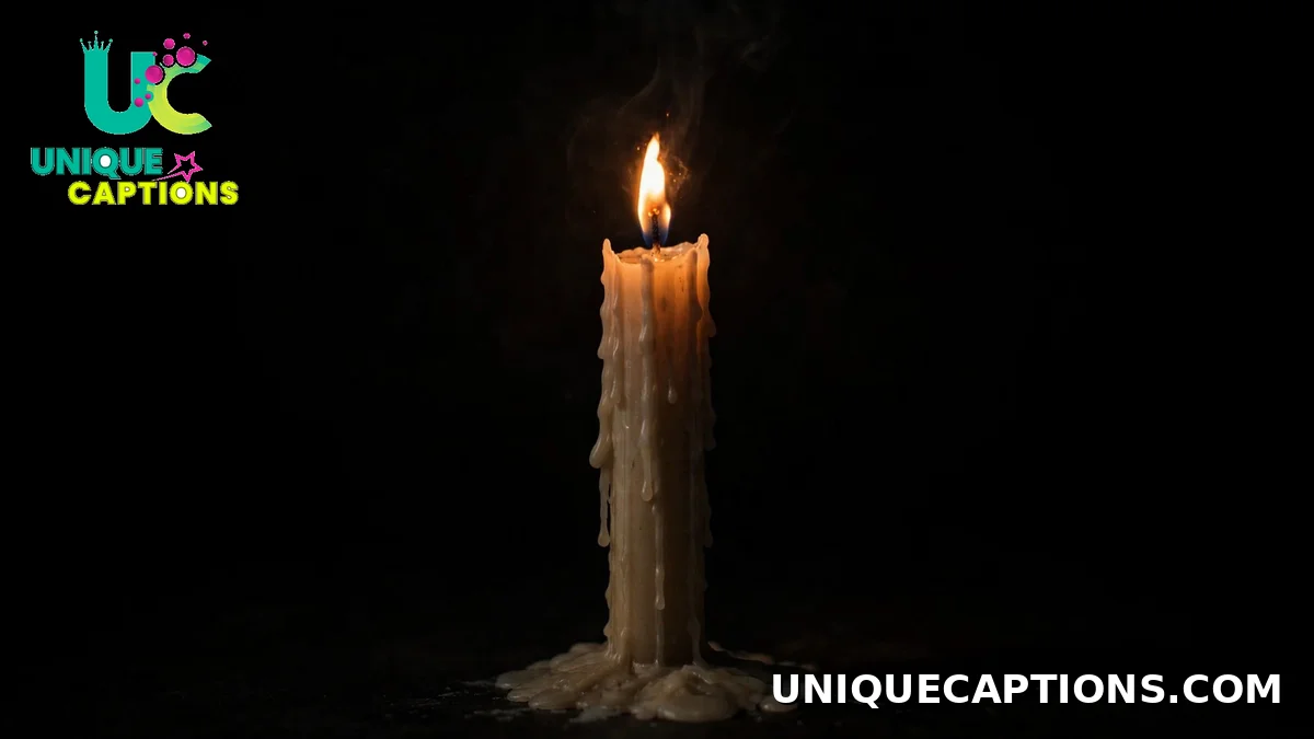 A single candle burning in complete darkness