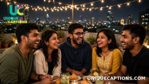 Group of Indian friends laughing together at a rooftop night gathering with city lights behind them
